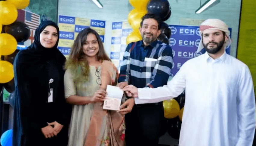 Sithara Krishnakumar and Sudheer Karamana receiving the Golden Visa from Iqbal Marconi (Source - Asianet News)